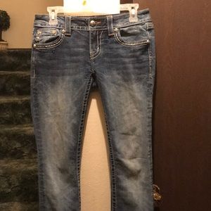 Miss Me jeans that are flared.